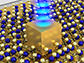 single gold nanocube sits on top of an atom-thin material