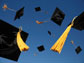 graduation caps thrown up in the air