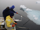 researchers pushing ice-floes away