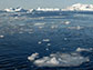 Body of water with ice in background