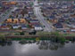 homes behind a levee in Stockton, California