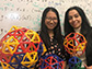 Siyu Li (left) and Roya Zandi holding various icosahedral structures
