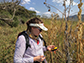Michelle Stitzer records the GPS coordinates of an individual Zea mays plant in a field
