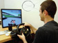 a student driving the video game TrackMania