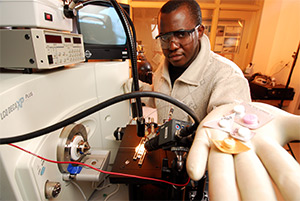 Photo of Georgia Tech graduate student Leonard Nyadong demonstrating an ionization technique.