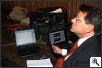 Scientist monitors results on computer -- Click to enlarge