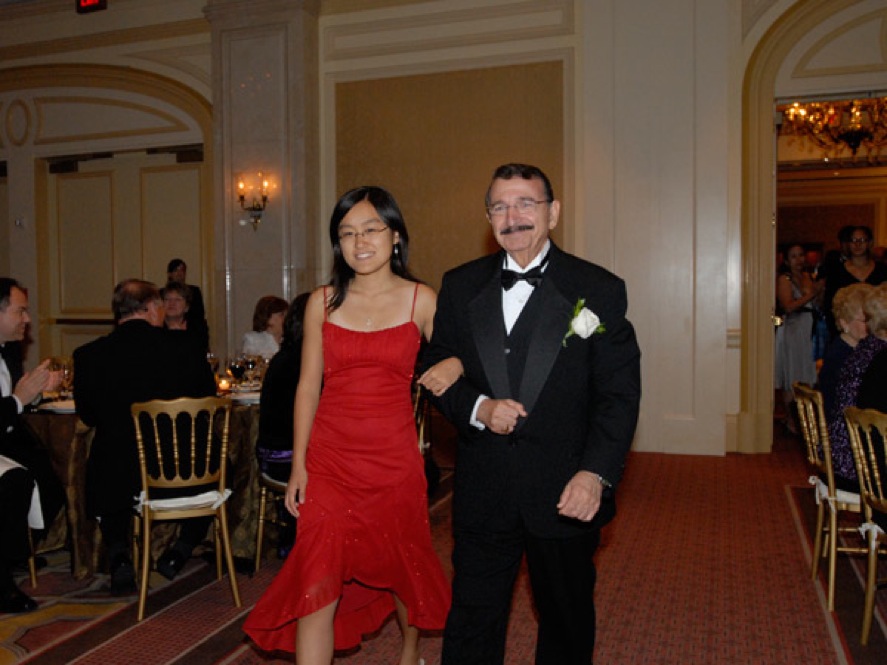 NMS Laureate Mostafa El-Sayed and a student at a gala