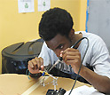 Male student soldering material