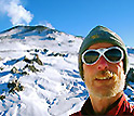 Photo of John Wood, teacher at Talbert Middle School in Huntington Beach, Calif., and snow-covered mountain in background