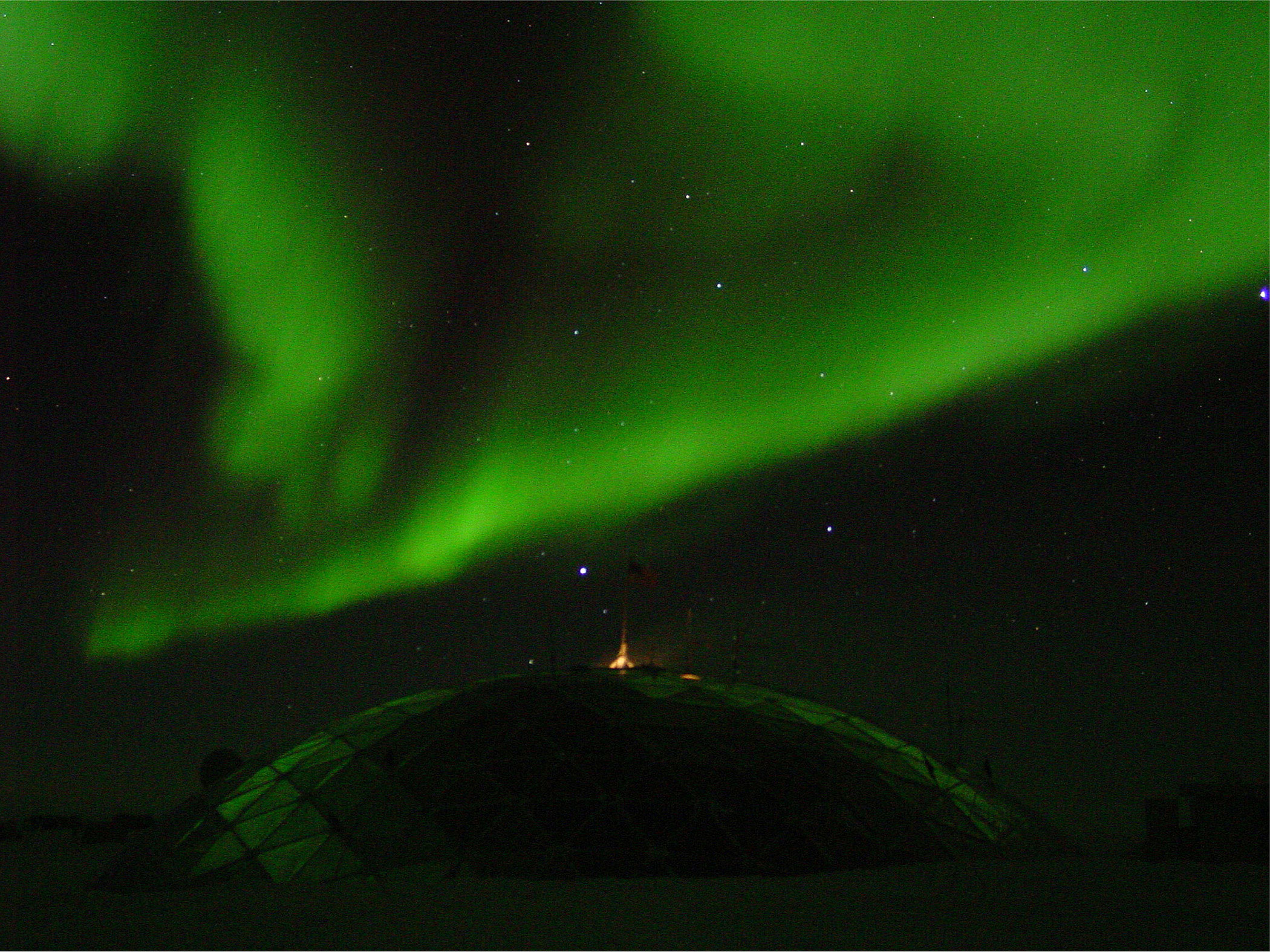 the Southern Lights, over the geodesic dome at NSF's Amundsen-Scott South Pole Station; caption is below