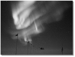 Southern Lights, over the flagline to a building at NSF's Amundsen-Scott South Pole Station; caption is below