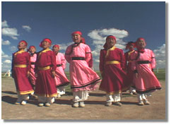 Singing children greet the group at Dalai Lake