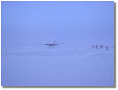 a Twin Otter lands at NSF's Amundsen-Scott South Pole Station