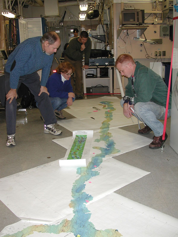 Researchers pore over a map of the Gakkel Ridge