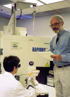 Two researchers with equipment.