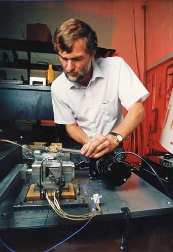 Dr. Scott Bair adjusting a custom reciprocating tribosimulator.