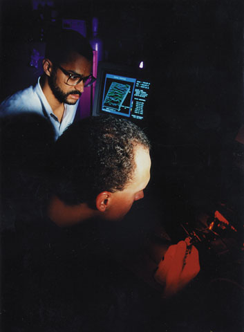 Professor Jeffery Streator and a graduate student analyze the surface of a magnetic hard disk drive by laser interferometry.